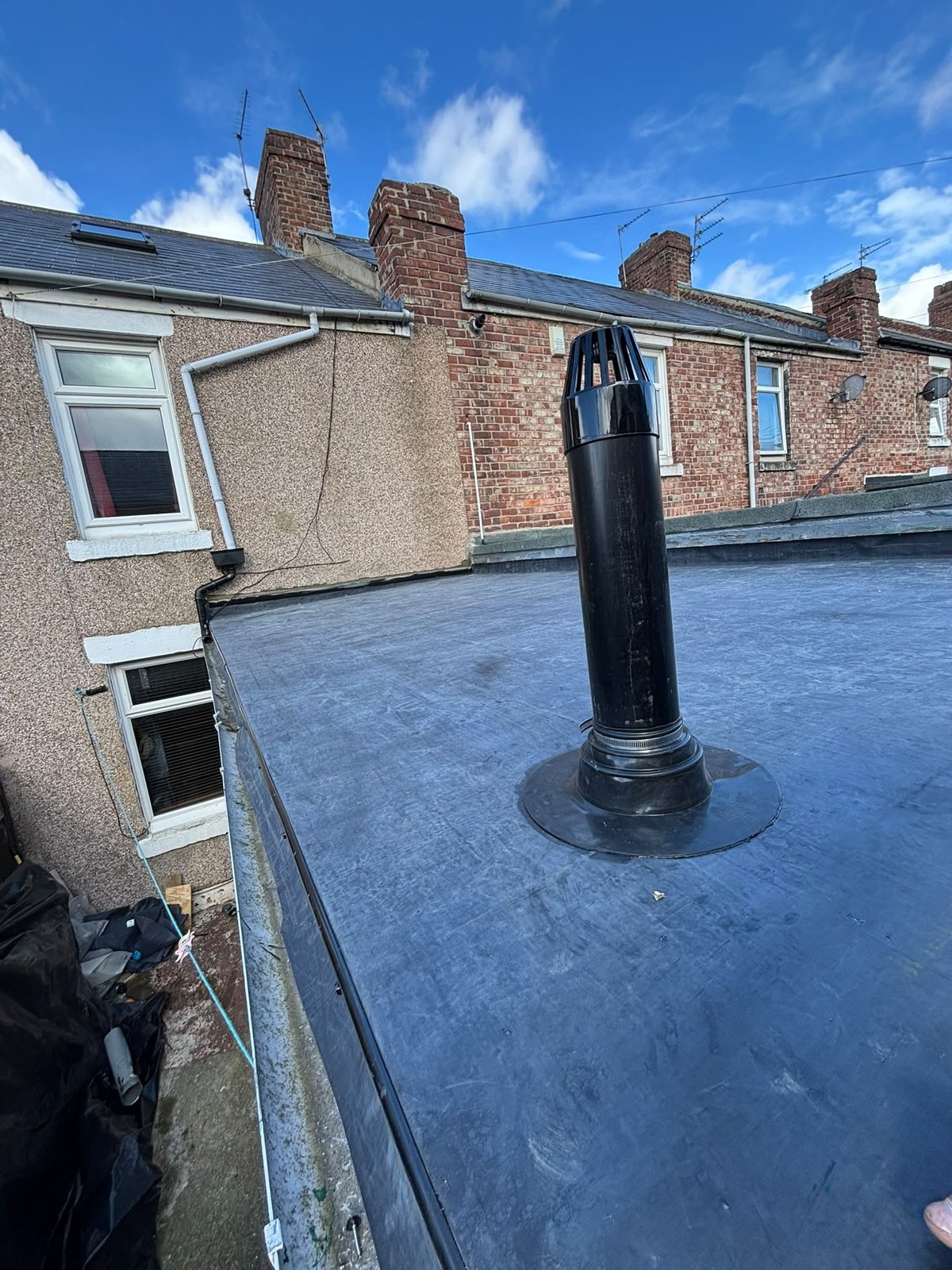 New EPDM rubber roof with a vent terminal